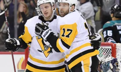 PITTSBURGH, PA - DECEMBER 17: Pittsburgh Penguins Right Wing Bryan Rust (17) celebrates his goal with Pittsburgh Penguins Right Wing Jake Guentzel (59) during the first period in the NHL game between the Pittsburgh Penguins and the Anaheim Ducks on December 17, 2018, at PPG Paints Arena in Pittsburgh, PA. (Photo by Jeanine Leech/Icon Sportswire)