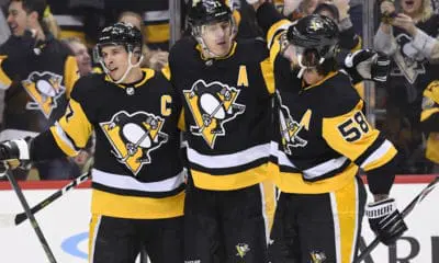 Pittsburgh Penguins Evgeni Malkin celebrates with Kris Letang and Sidney Crosby