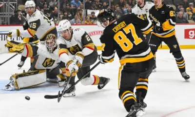 PITTSBURGH, PA - MARCH 11: Pittsburgh Penguins center Sidney Crosby (87) puts a shot on Vegas Golden Knights goaltender Ilya Samsonov (35) as Vegas Golden Knights defenseman Zach Whitecloud (2) defends during the first period in the NHL game between the Pittsburgh Penguins and the Vegas Golden Knights on March 11, 2025, at PPG Paints Arena in Pittsburgh, PA. (Photo by Jeanine Leech/Icon Sportswire)