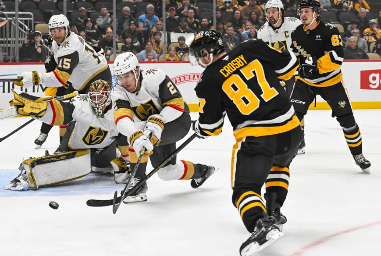 PITTSBURGH, PA - MARCH 11: Pittsburgh Penguins center Sidney Crosby (87) puts a shot on Vegas Golden Knights goaltender Ilya Samsonov (35) as Vegas Golden Knights defenseman Zach Whitecloud (2) defends during the first period in the NHL game between the Pittsburgh Penguins and the Vegas Golden Knights on March 11, 2025, at PPG Paints Arena in Pittsburgh, PA. (Photo by Jeanine Leech/Icon Sportswire)