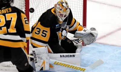 Pittsburgh Penguins game, Ryan Graves and Tristan Jarry.