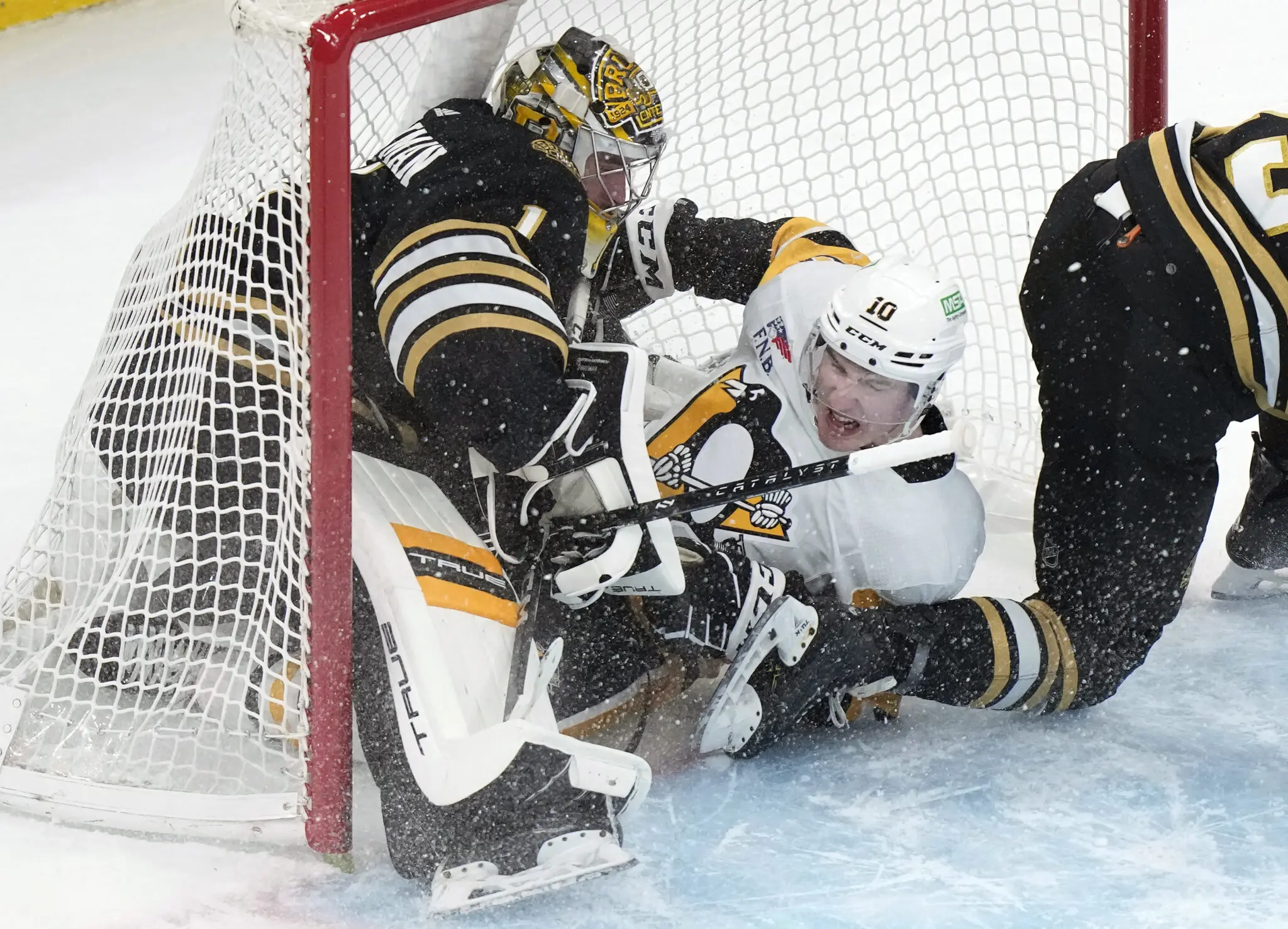 Drew O'Connor and Boston goalie Jeremy Swayman