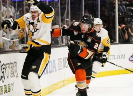 Pittsburgh Penguins center Evgeni Malkin, left, reacts after making contact with Anaheim Ducks center Mason McTavish, who lost his stick, during the second period of an NHL hockey game Tuesday, Nov. 7, 2023, in Anaheim, Calif. (AP Photo/Ryan Sun)