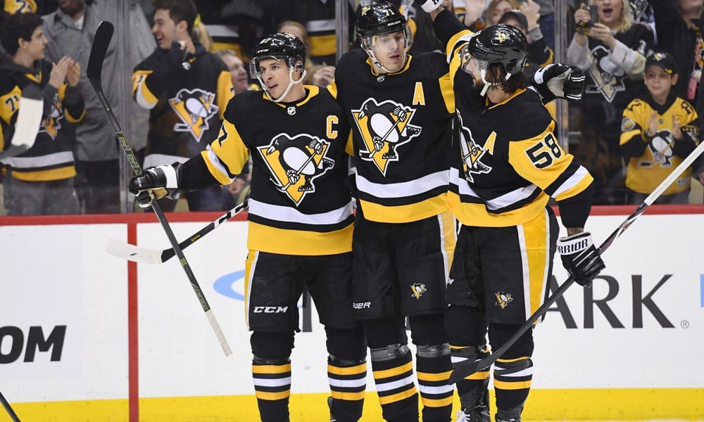 Pittsburgh Penguins Evgeni Malkin celebrates with Kris Letang and Sidney Crosby