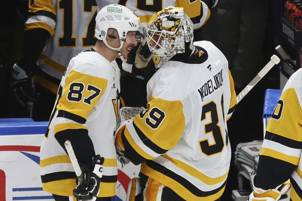 Pittsburgh Penguins Sidney Crosby congratulates Alex Nedeljkovic