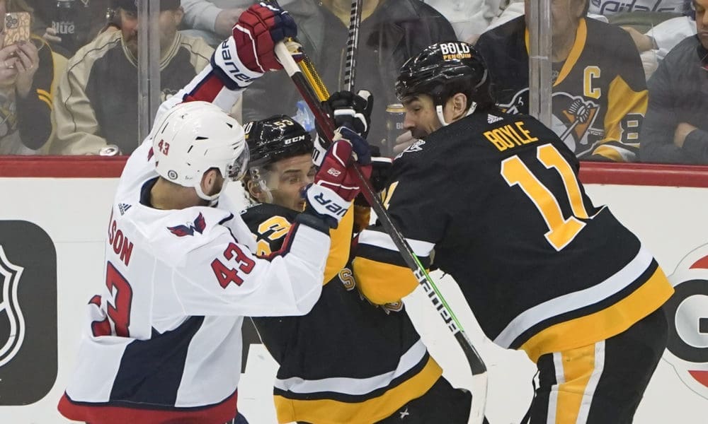 NHL trade, Pittsburgh Penguins Brian Boyle shoves Washington's Tom Wilson.