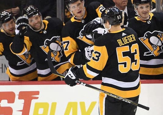 Penguins center Teddy Blueger (53) celebrates with right wing Phil Kessel  (81) after Blueger scored a goal, his second of the night, during the third  period of an NHL hockey game against